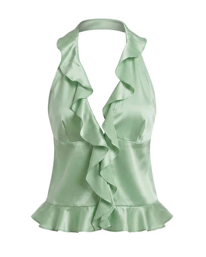 Light mint green silk halter top with ruffled details on a white background